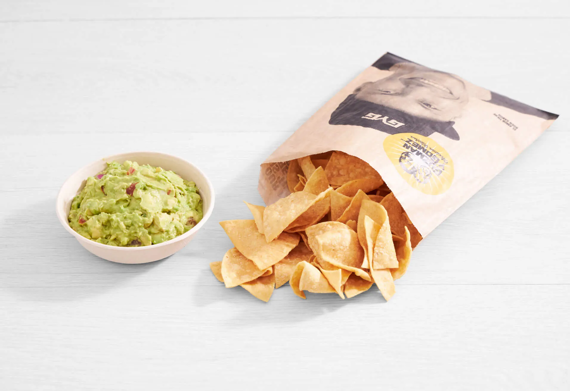 a bag of chips and guacamole