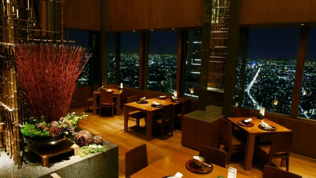 Is Sky-High Dining Worth It? The Truth at 81 Floors Up 2 Sky-high dining table with gourmet dishes and sweeping cityscape backdrop.